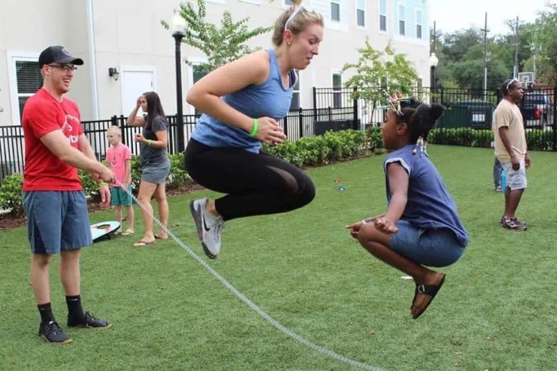 Sulzbacher Village Afterschool Program women and a young girl jump roping