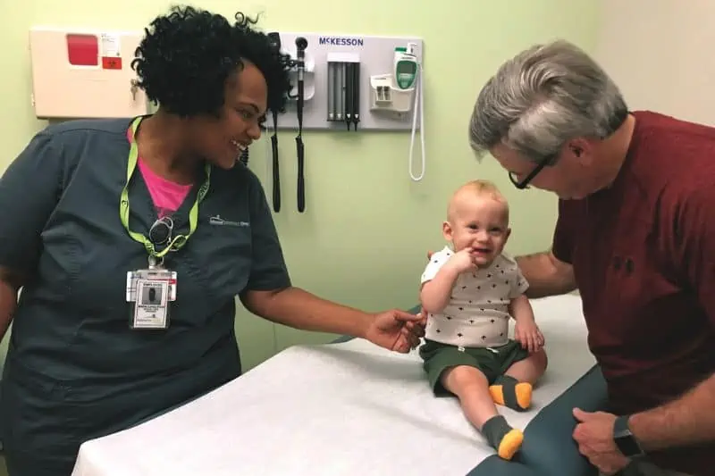 toddler boy smiling during a pediatric visit