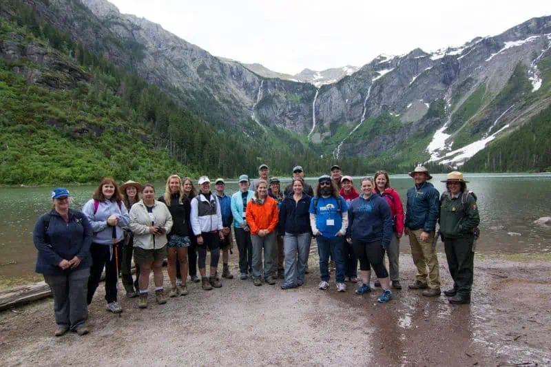 Grizzly Point Station Staff pose for a photo by the water