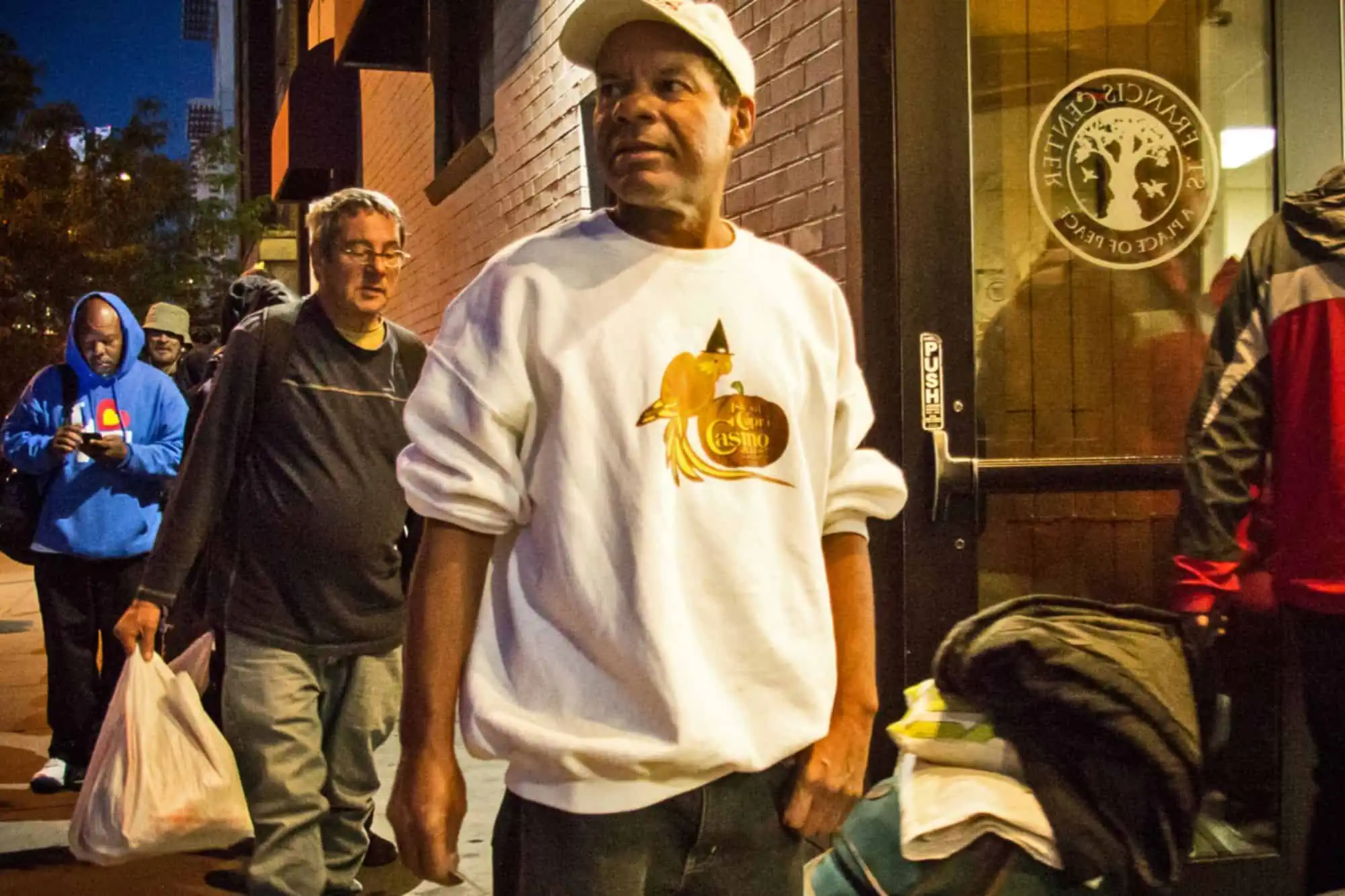 men standing outside waiting to go in St Francis Center