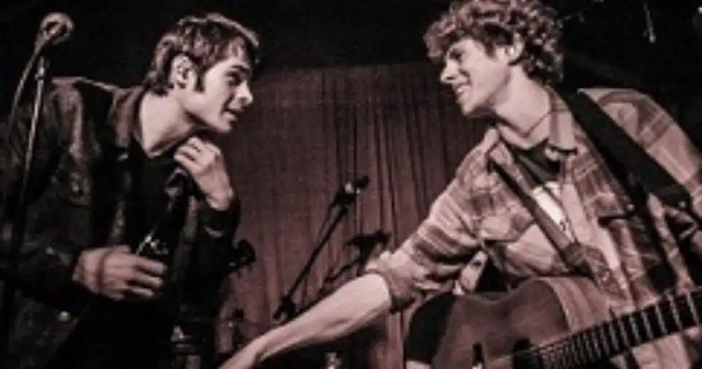 two rock band members on stage