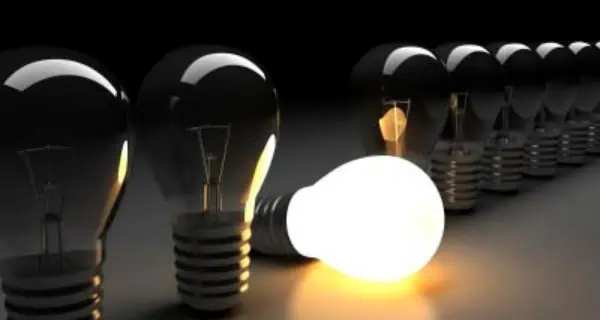 light bulbs lined up with one tipped over and on