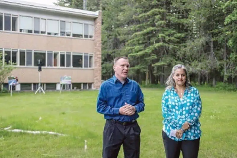 2 people outside glacier headquaters