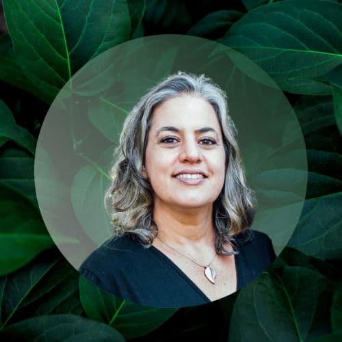 Myriam Scally headshot with green leaf background