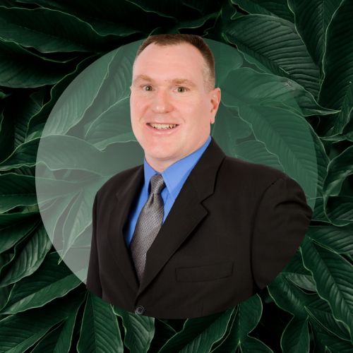 Richard Marino headshot with green leaf background