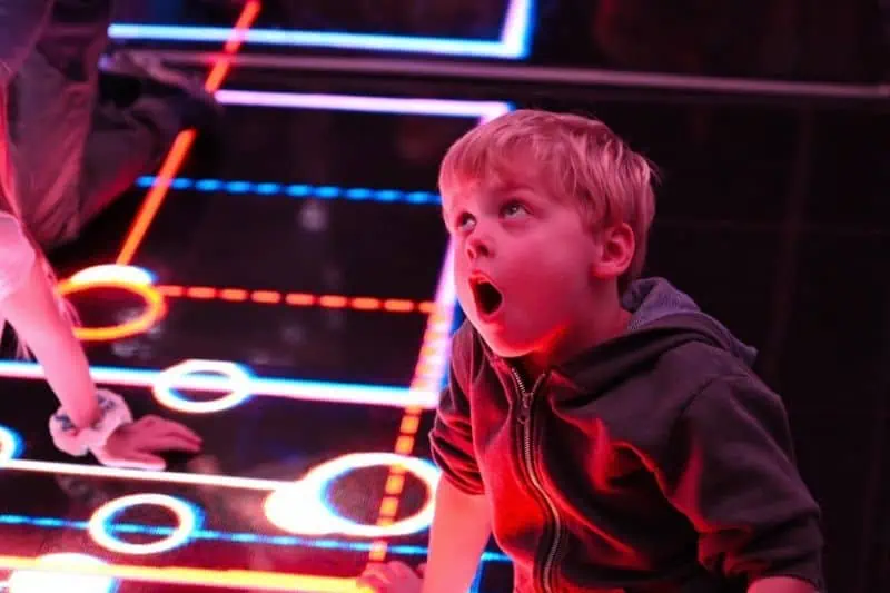 young boy playing in the science center