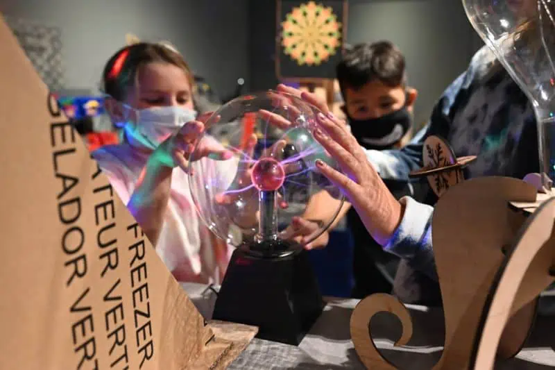 group of young kids doing a science experiment
