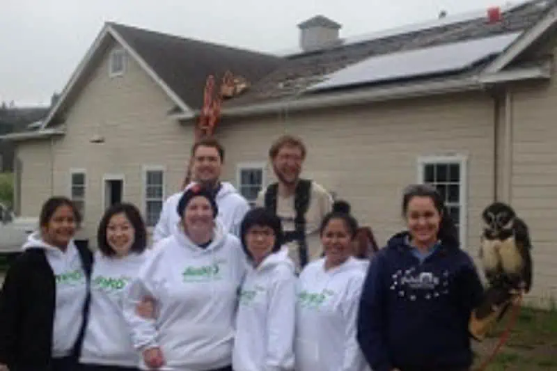 jinko associates in front of a home that had solar added