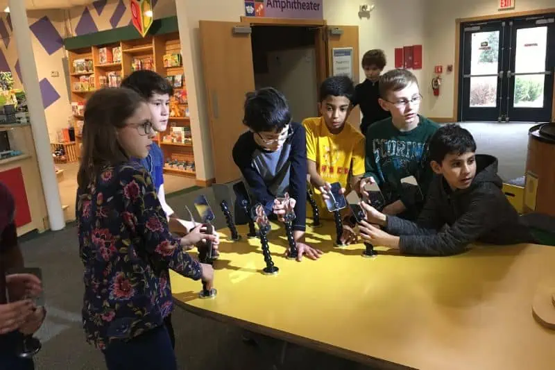 kids working on a science project at a table