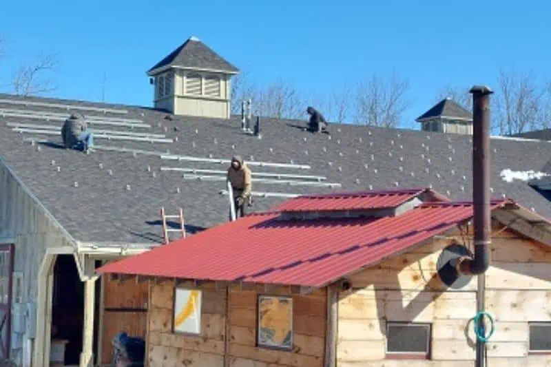 solar being installed on an old out building