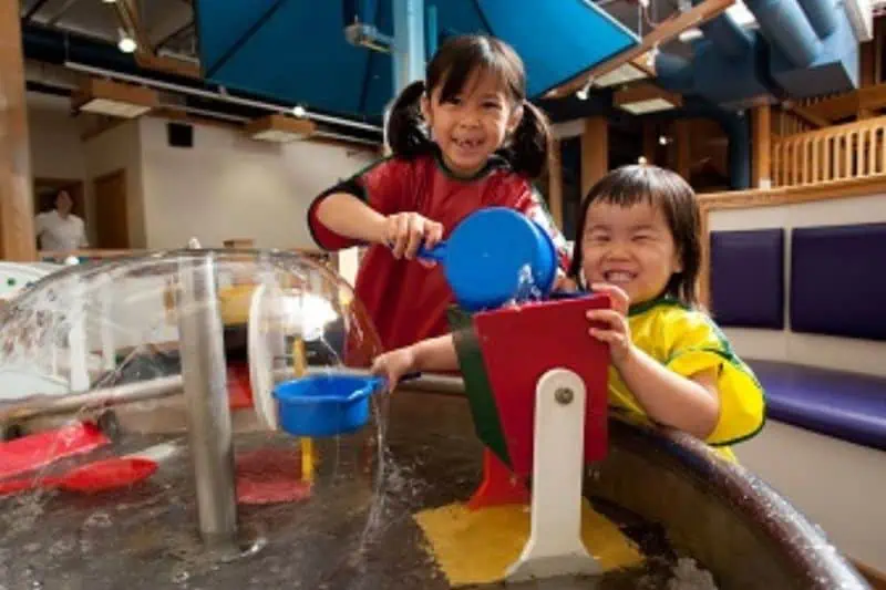 two children doing science project