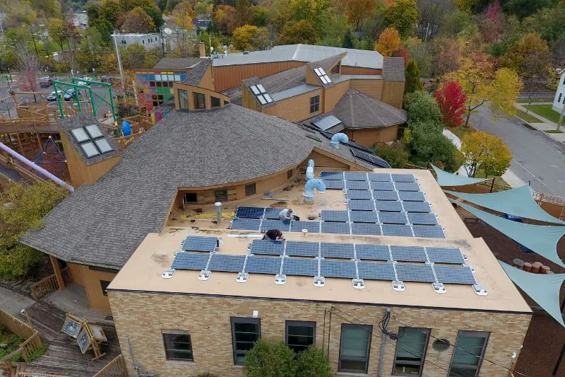 sciencenter ariel view of solar panels being installed on the roof