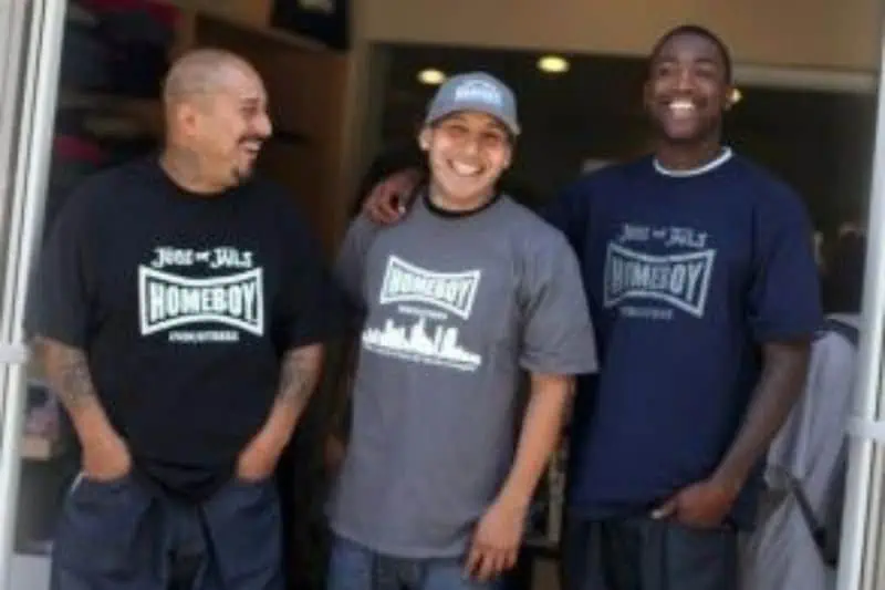 three men standing smiling