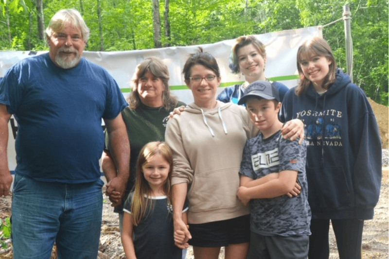 group of people standing at a construction site